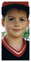 In the dugout at one of his little league games.